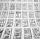 Multiple hand-drawn sketches of mobile user interface designs are spread out in a grid pattern. Each sketch contains various UI elements such as buttons, text boxes, images, and icons.